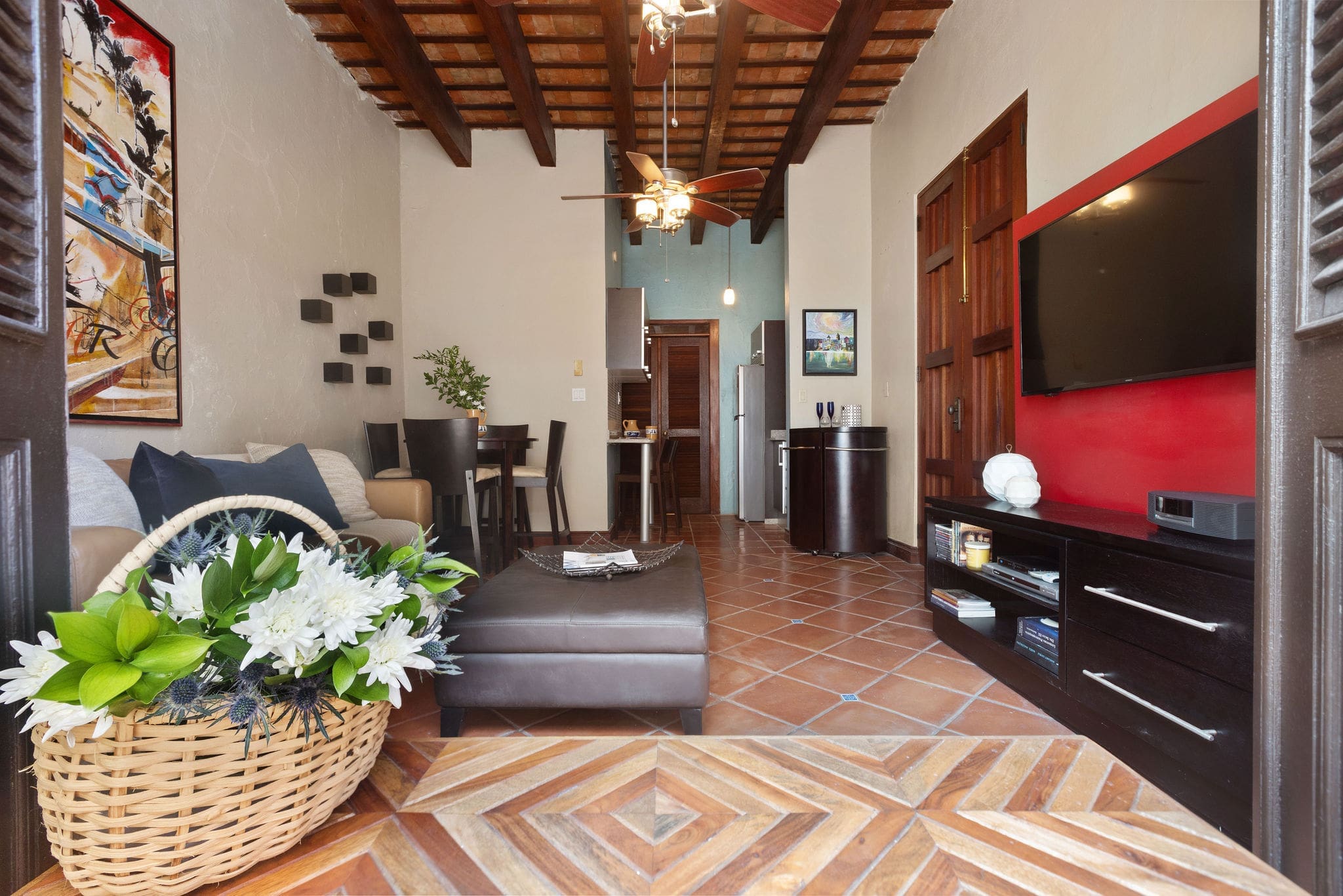Living room with exposed wooden beams in Old San Juan apartment